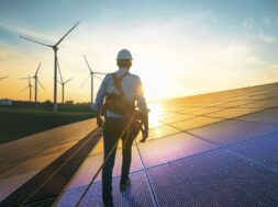 Professional,Male,Green,Energy,Engineer,Walking,On,Solar,Panel,,Wearing