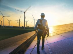 Professional,Male,Green,Energy,Engineer,Walking,On,Solar,Panel,,Wearing